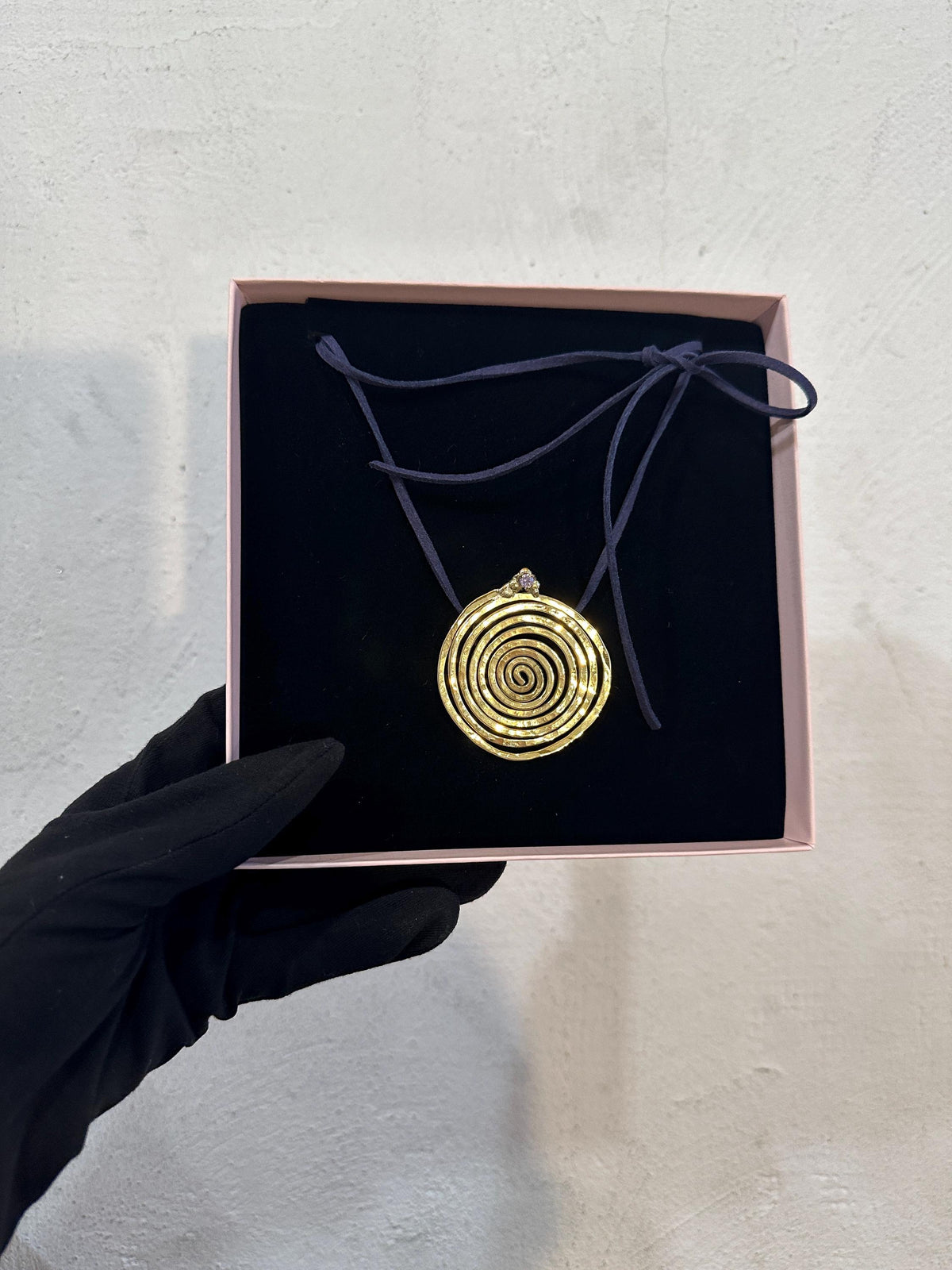 Spiral Pendant Necklace: A Sculptural Brass Piece with Zircon Detail