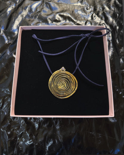 Spiral Pendant Necklace: A Sculptural Brass Piece with Zircon Detail
