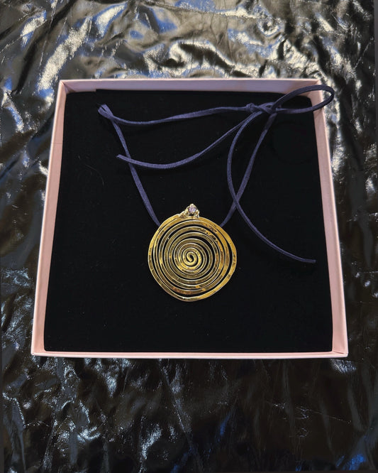 Spiral Pendant Necklace: A Sculptural Brass Piece with Zircon Detail