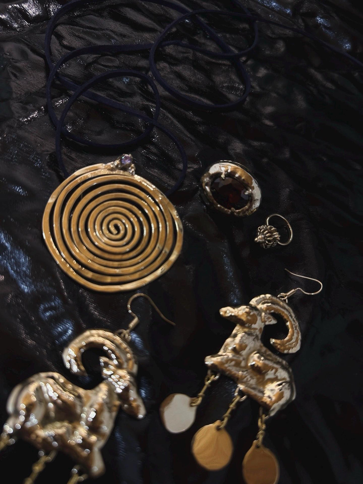 Spiral Pendant Necklace: A Sculptural Brass Piece with Zircon Detail