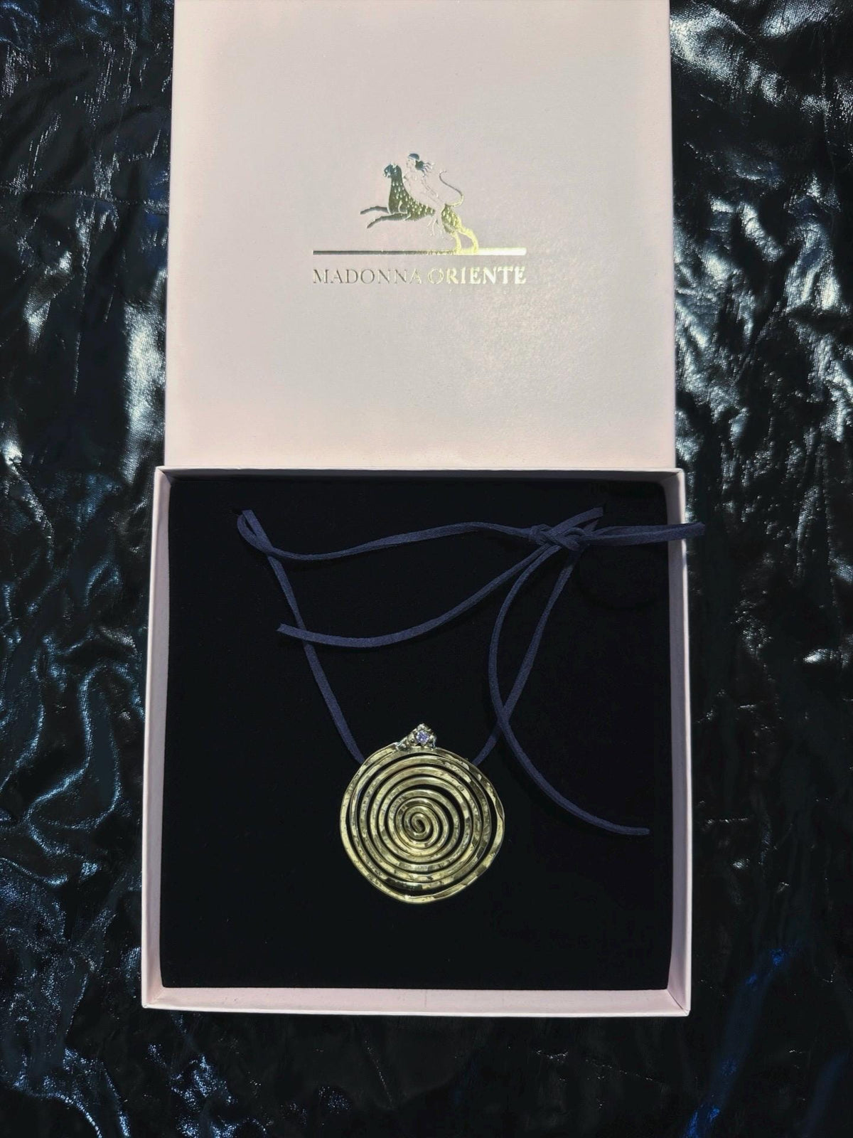 Spiral Pendant Necklace: A Sculptural Brass Piece with Zircon Detail