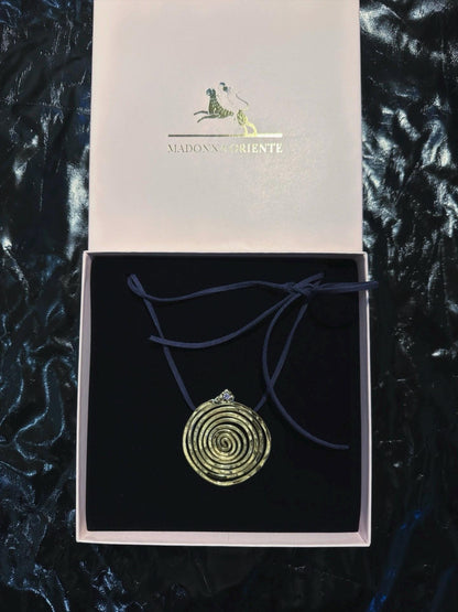 Spiral Pendant Necklace: A Sculptural Brass Piece with Zircon Detail